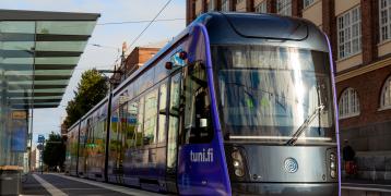 Modern tram is an integral part of Tampere logistics system. Tram running in the street of Tampere