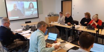 Aland Island peer experts sitting Aland Island peer experts discussing