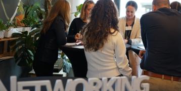 Networking at events Group of people in circle with networking hashtag in front