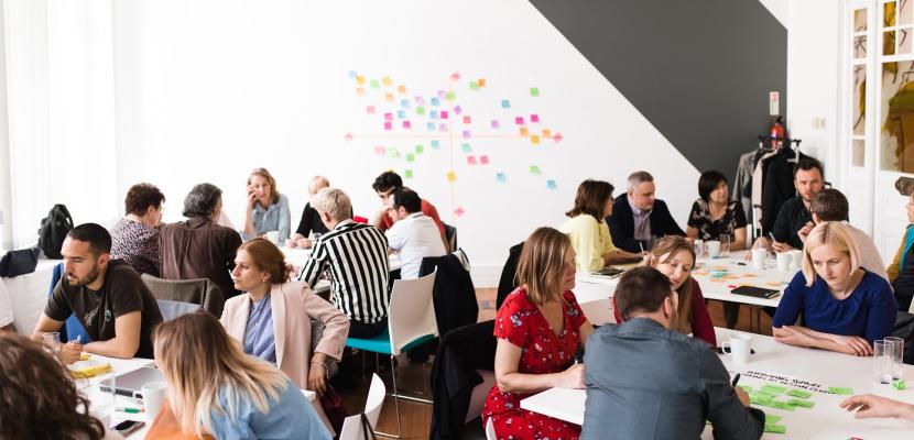 People working in groups on post-its People working in groups on post-its