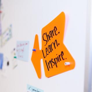 Post-it on board with inspirational words Post-it on board with inspirational words