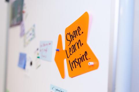 Post-it on board with inspirational words Post-it on board with inspirational words