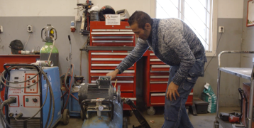 Person working in workshop Person working in workshop